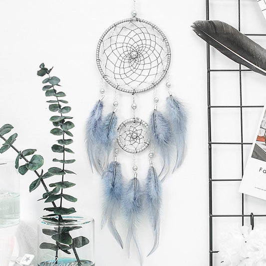 Dream catcher with feather pendant