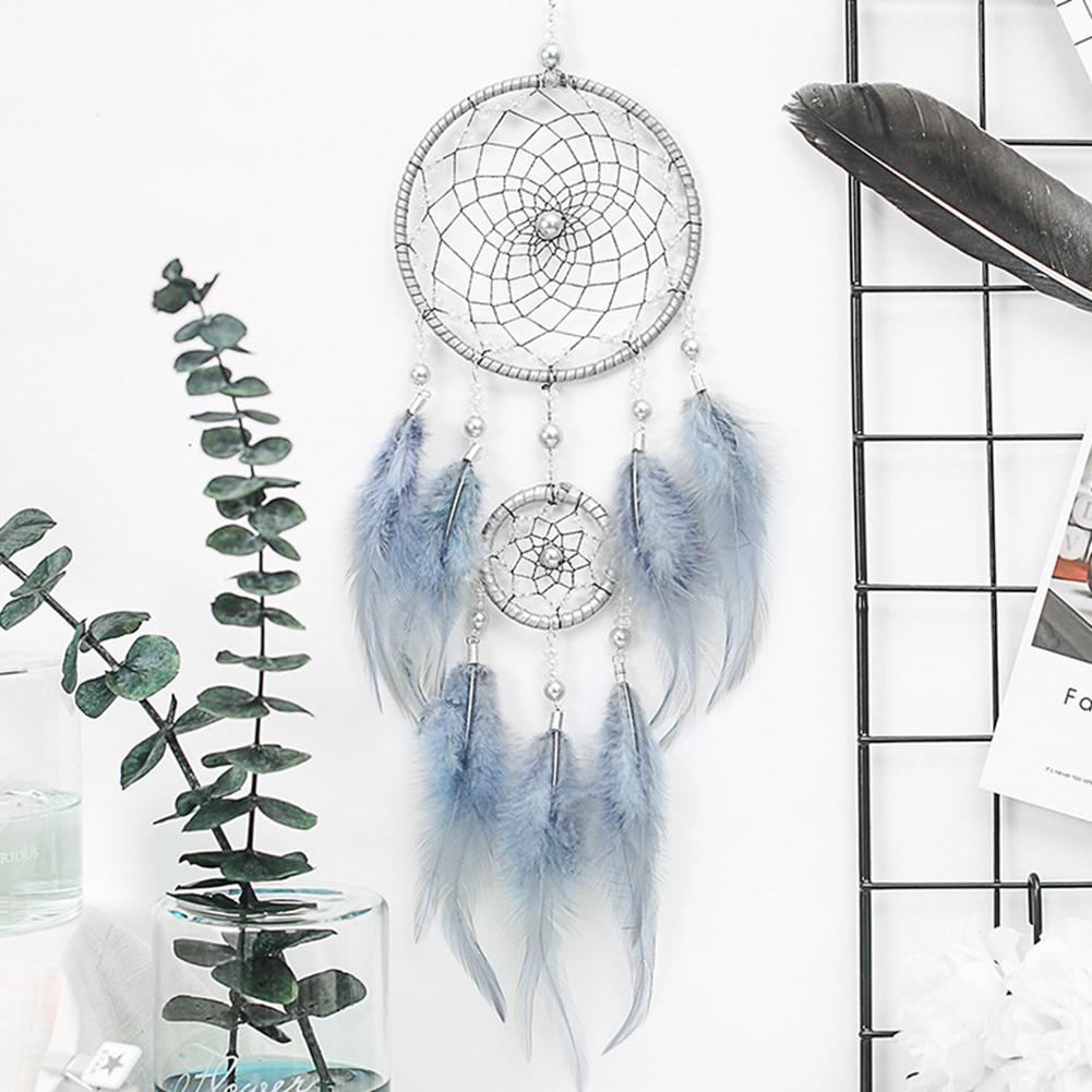 Dream catcher with feather pendant
