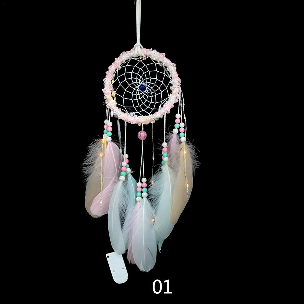 Dream catcher with feather pendant